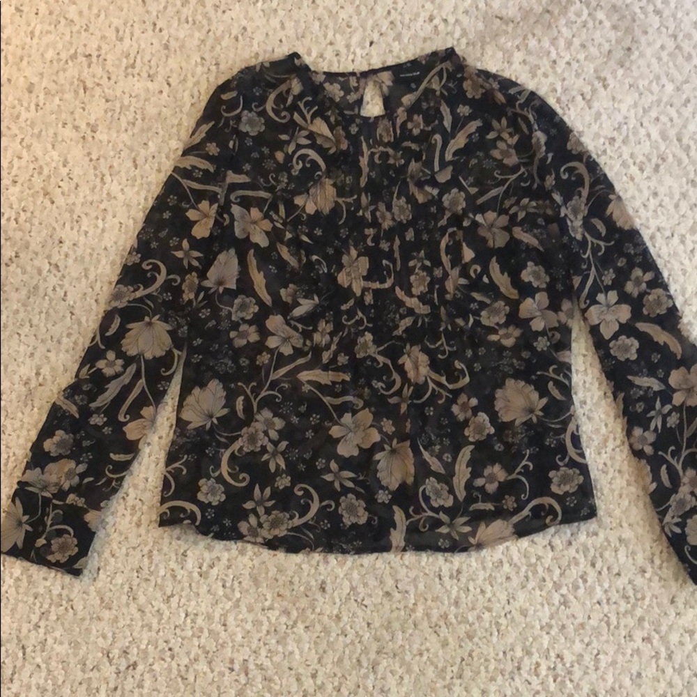 Whowhatwear patterned blouse with ruffle detail!